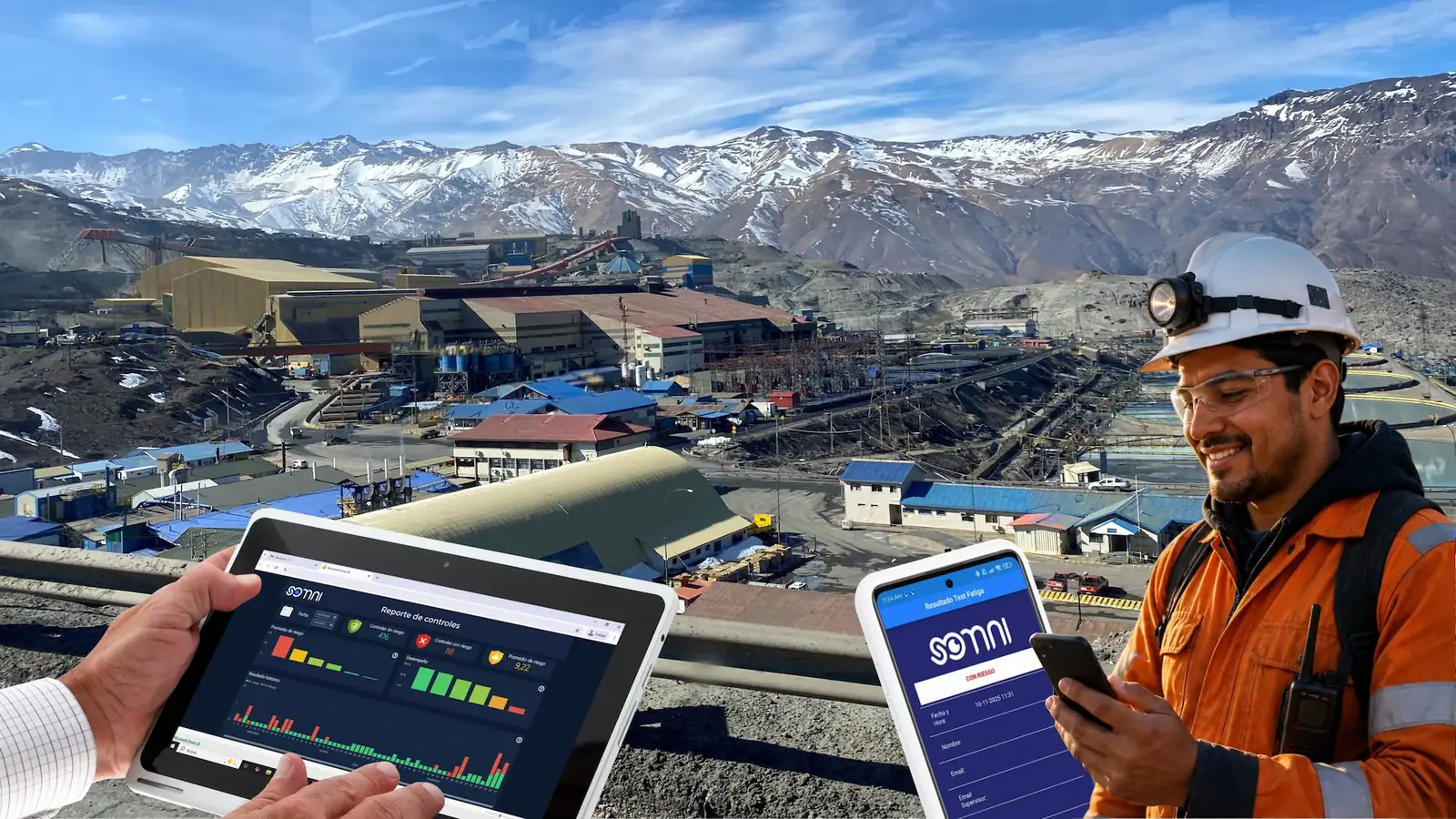 Operador minero usando la app SOMNI en faena, con tablet del dashboard de resultados y la cordillera al fondo
